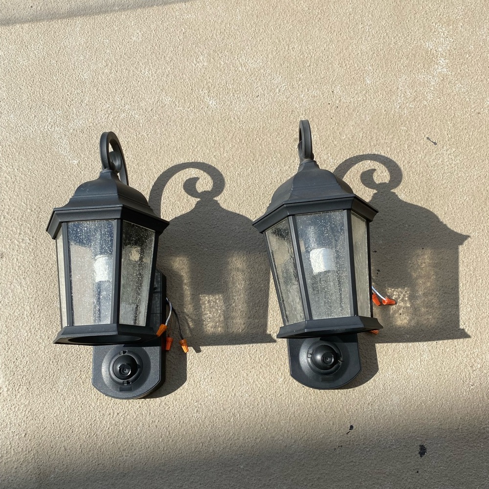 (2) KUNA Security Cameras Style “Coach Lamp” with a hidden eye attached.